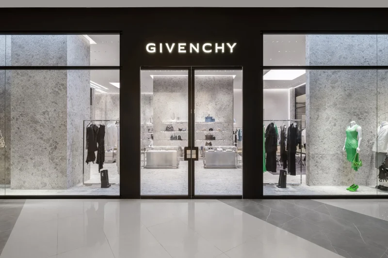 Givenchy boutique entrance and facade at Siam Paragon, Bangkok, with clothing racks visible through glass doors