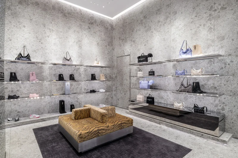 Givenchy Siam Paragon boutique seating area with shoes and handbags on stone display shelves