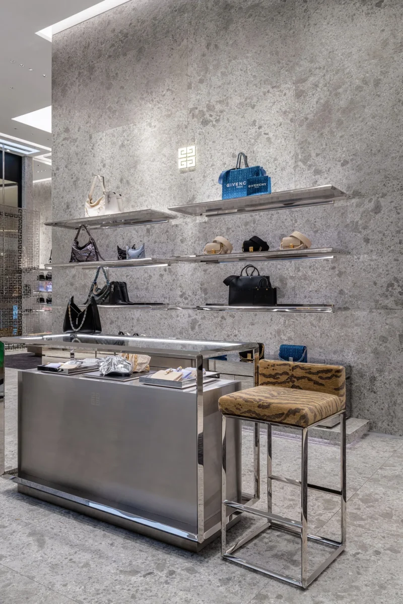 Givenchy Siam Paragon counter with tiger-print stool and handbag display shelves