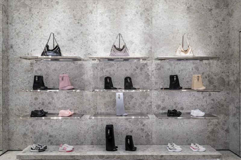 Wall display of Givenchy handbags, boots, and sneakers at Siam Paragon boutique