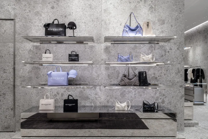 Shelved Givenchy tote bags, crossbody bags, and caps on display at Siam Paragon boutique
